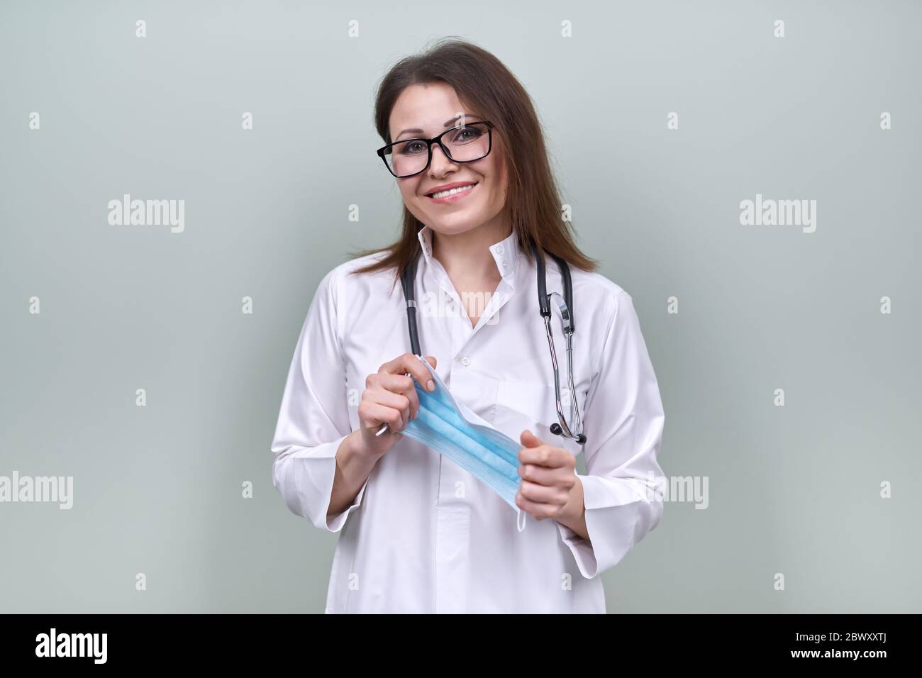 Professional puts face mask woman hi-res stock photography and images ...
