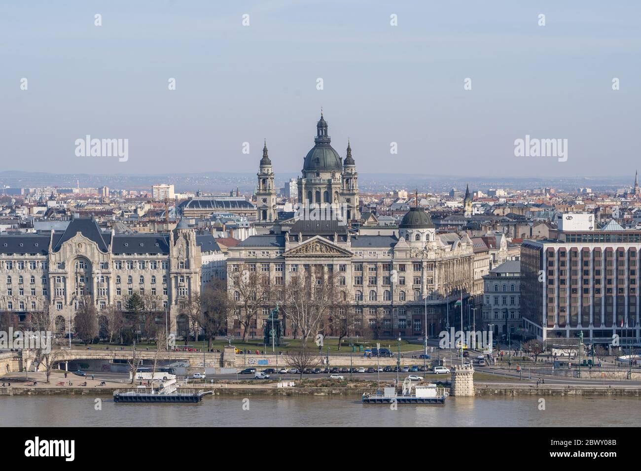 Gresham Palace with St. Stephen's Basilica on Danube riverside in Budapest winter morning Stock Photo