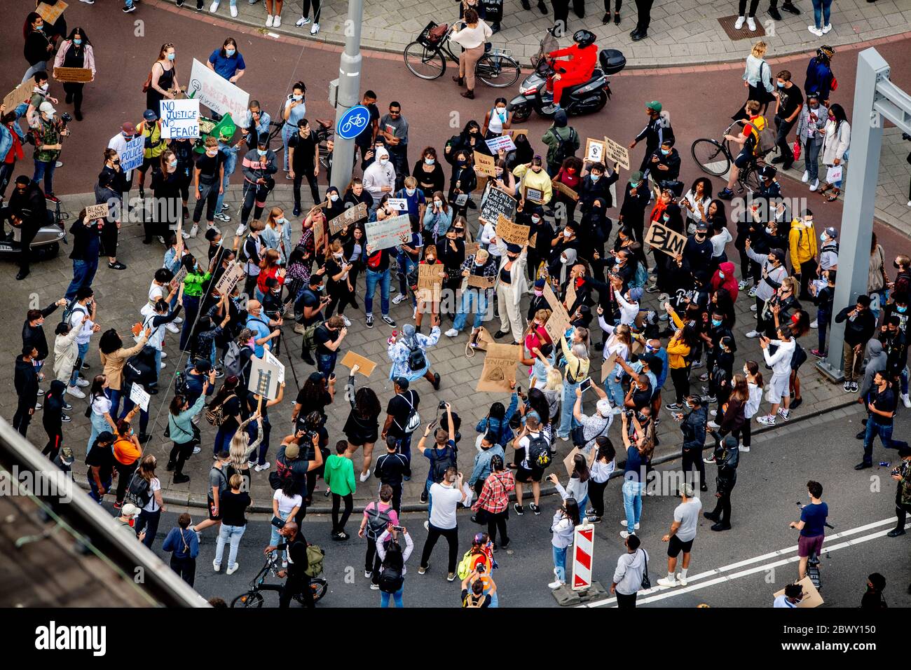 Thousands of people line Erasmus Bridge as they take part in a demonstration to protest against the recent killing of George Floyd, police violence and institutionalized racism. Floyd, a black man, died in police custody in Minneapolis, U.S.A., after being restrained by police officers on May 25, 2020. Stock Photo