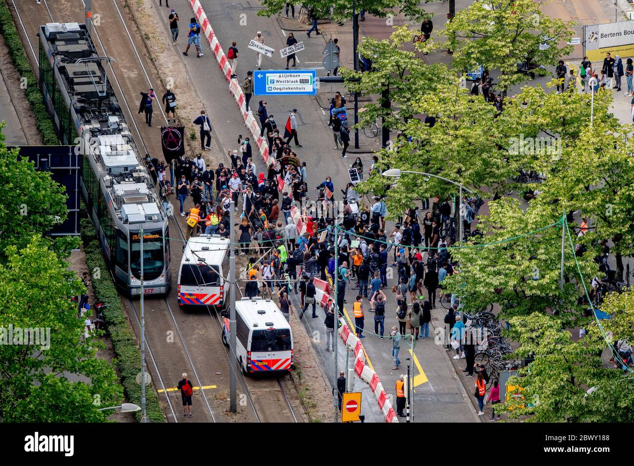 Thousands of people line Erasmus Bridge as they take part in a demonstration to protest against the recent killing of George Floyd, police violence and institutionalized racism. Floyd, a black man, died in police custody in Minneapolis, U.S.A., after being restrained by police officers on May 25, 2020. Stock Photo