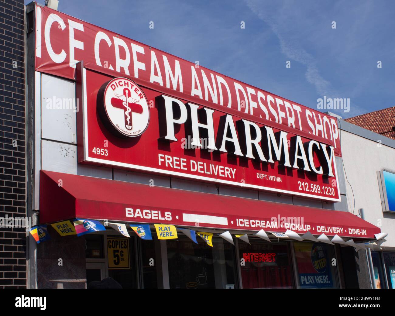 Dichter Pharmacy, an independent pharmacy in Inwood, must advertise unhealthy sweets in order  to stay in business and compete against chain stores Stock Photo