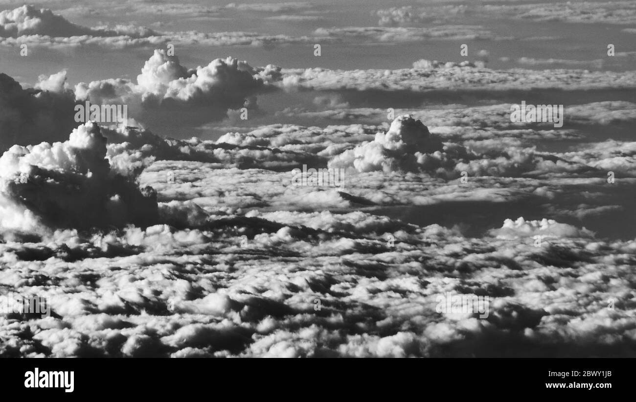 Black and White cumulus clouds on clear sky Stock Photo - Alamy