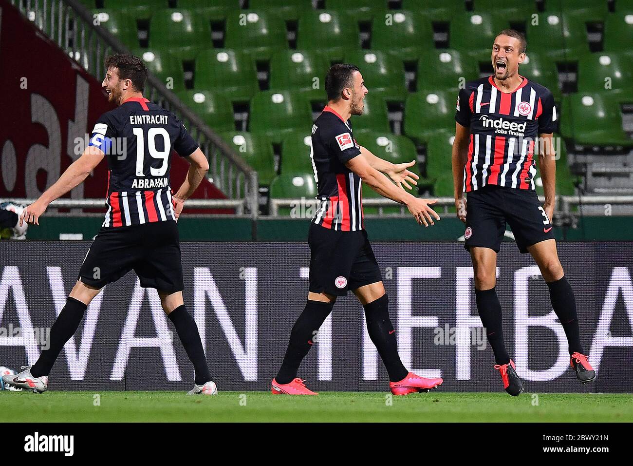 Bremen, Germany. 03rd June, 2020. Football: Bundesliga, Werder Bremen - Eintracht Frankfurt at the wohninvest Weser Stadium. Frankfurt's Stefan IIsanker (r) celebrates his goal of 0:2 with Filip Kostic (M) and David Abraham. Credit: Stuart Franklin/Getty Images Europe/Pool/dpa - IMPORTANT NOTE: In accordance with the regulations of the DFL Deutsche Fußball Liga and the DFB Deutscher Fußball-Bund, it is prohibited to exploit or have exploited in the stadium and/or from the game taken photographs in the form of sequence images and/or video-like photo series./dpa/Alamy Live News Stock Photo