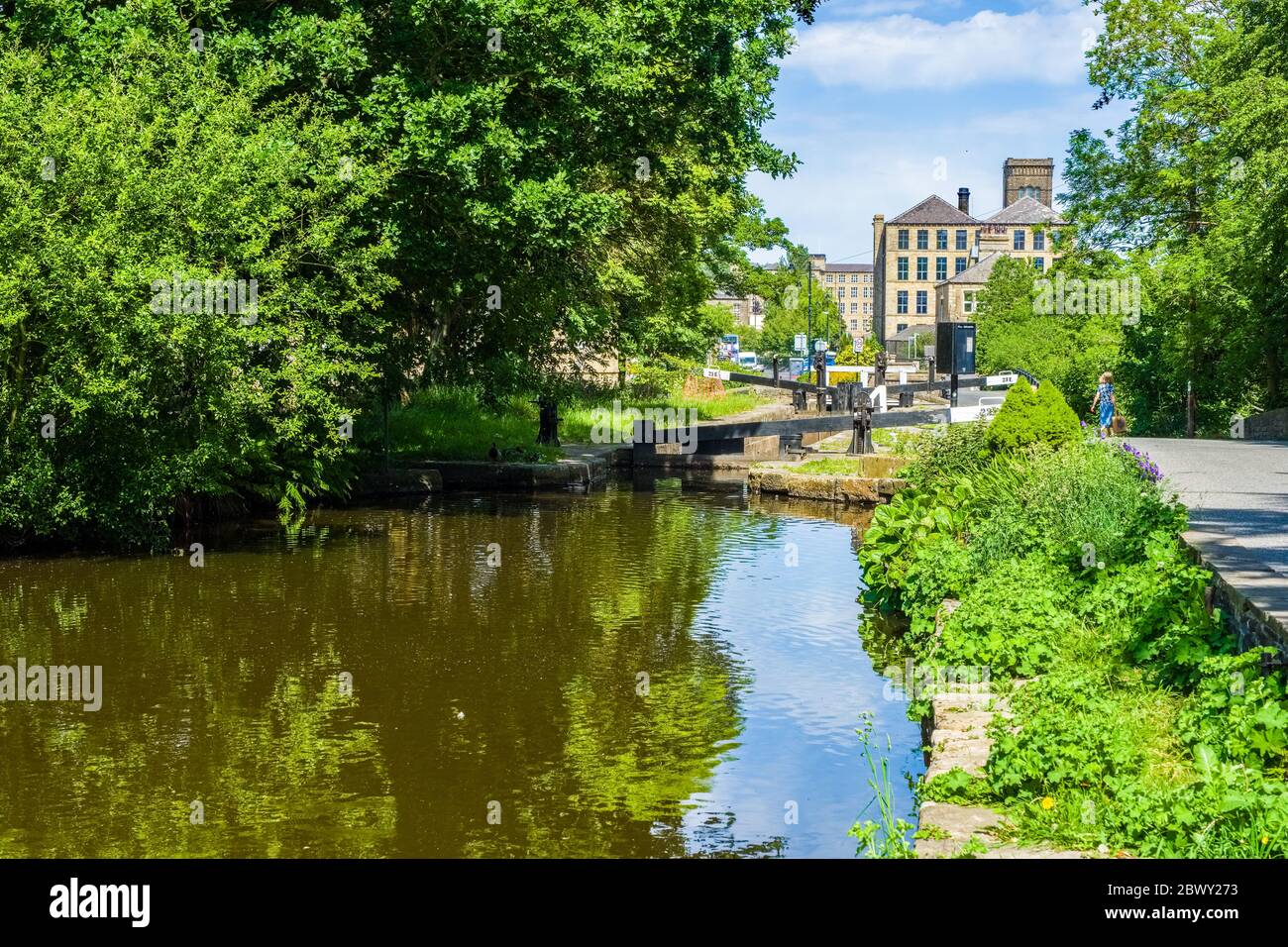 The Huddersfield canal in the centre of the village of Slaithwaite in the Colne Valley in West Yorkshire, UK Stock Photo