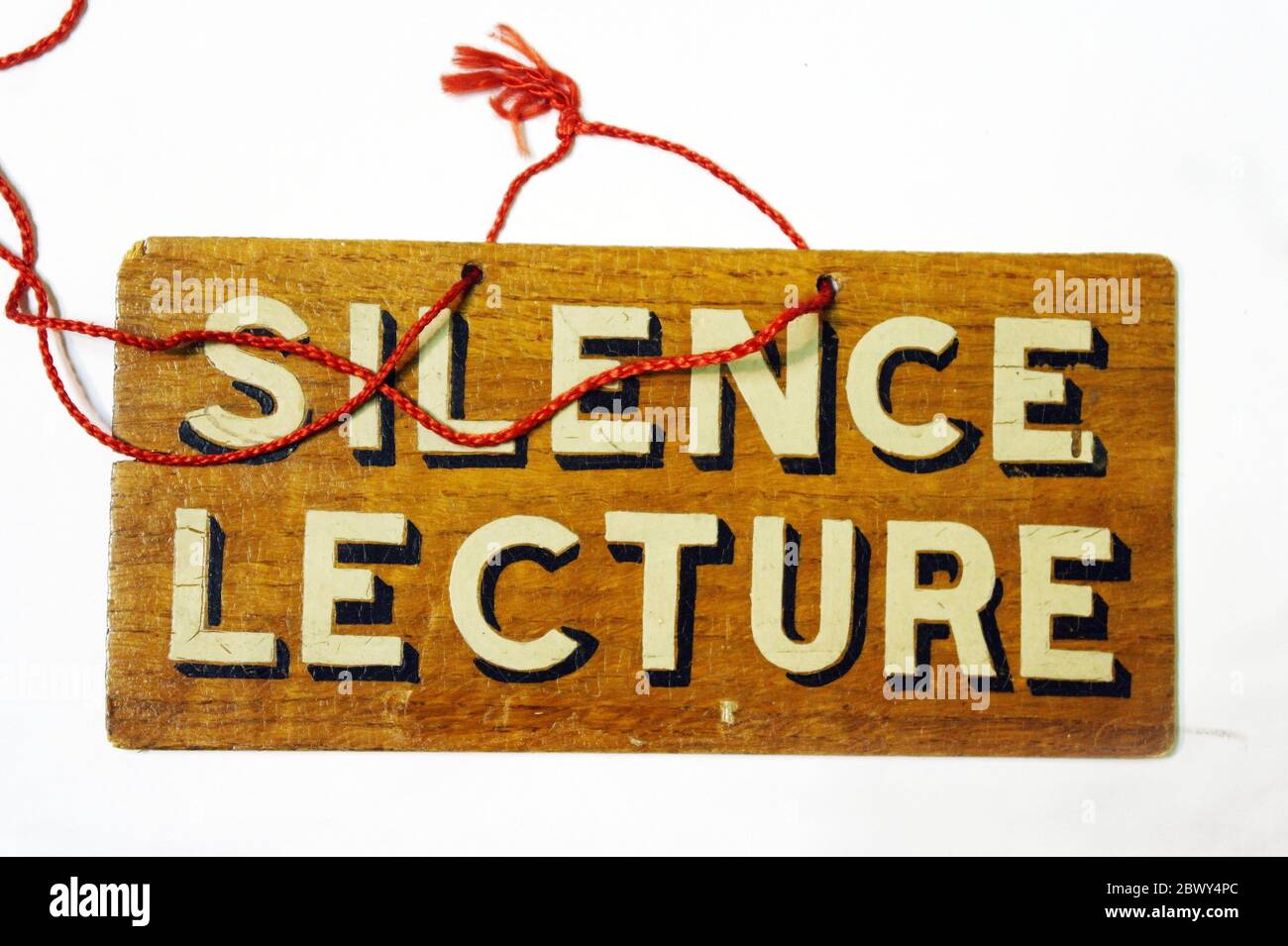 A very old sign requesting silence during a lecture. Stock Photo