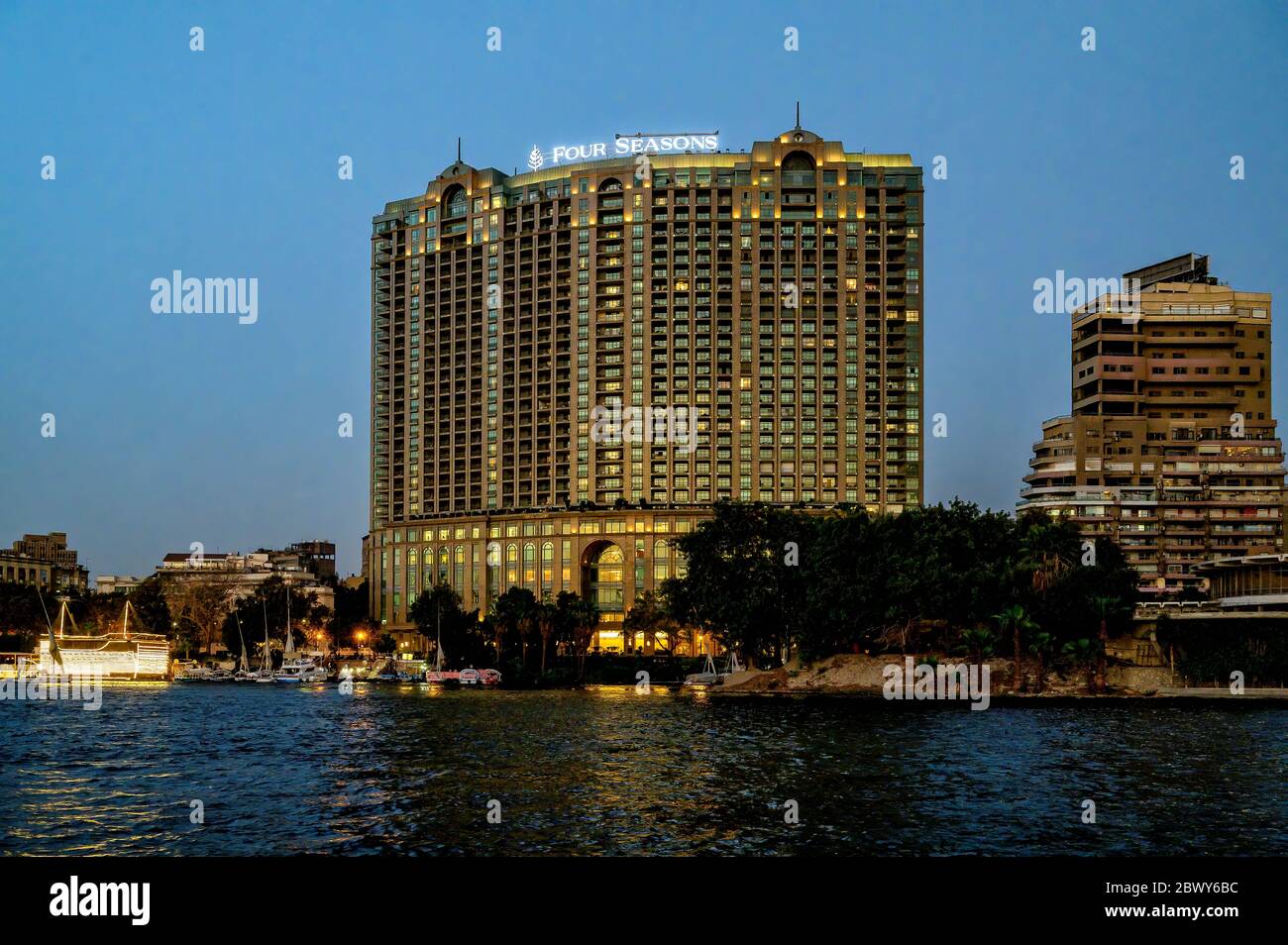 The luxurious Four Seasons Hotel in Garden City, Cairo,  an evening view from a Felucca on the River Nile Stock Photo