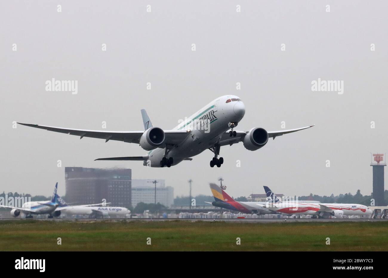 Narita, Japan. 3rd June, 2020. Japan Airlines' (JAL) new budget airline ZipAir Tokyo Boeing 787 plane flies to Bangkok carrying 13-ton machinery parts for the first revenue flight at the Narita international airport in Narita, suburban Tokyo on Wednesday, June 3, 2020. Japan's first long distance low cost carrier ZipAir scheduled to launch the passenger flight service last month but delayed their services since outbreak of the new coronavirus. Credit: Yoshio Tsunoda/AFLO/Alamy Live News Stock Photo