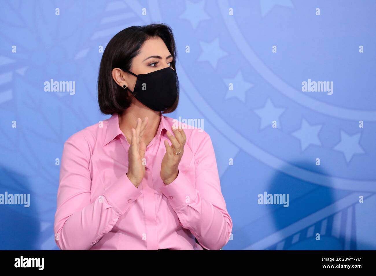 Brazilian First Lady Michelle Bolsonaro, wears a mask amid the COVID-19 pandemic, during an event promoting a government campaign against domestic violence at Planalto presidential palace May 15, 2020 in Brasilia, Brazil. Stock Photo