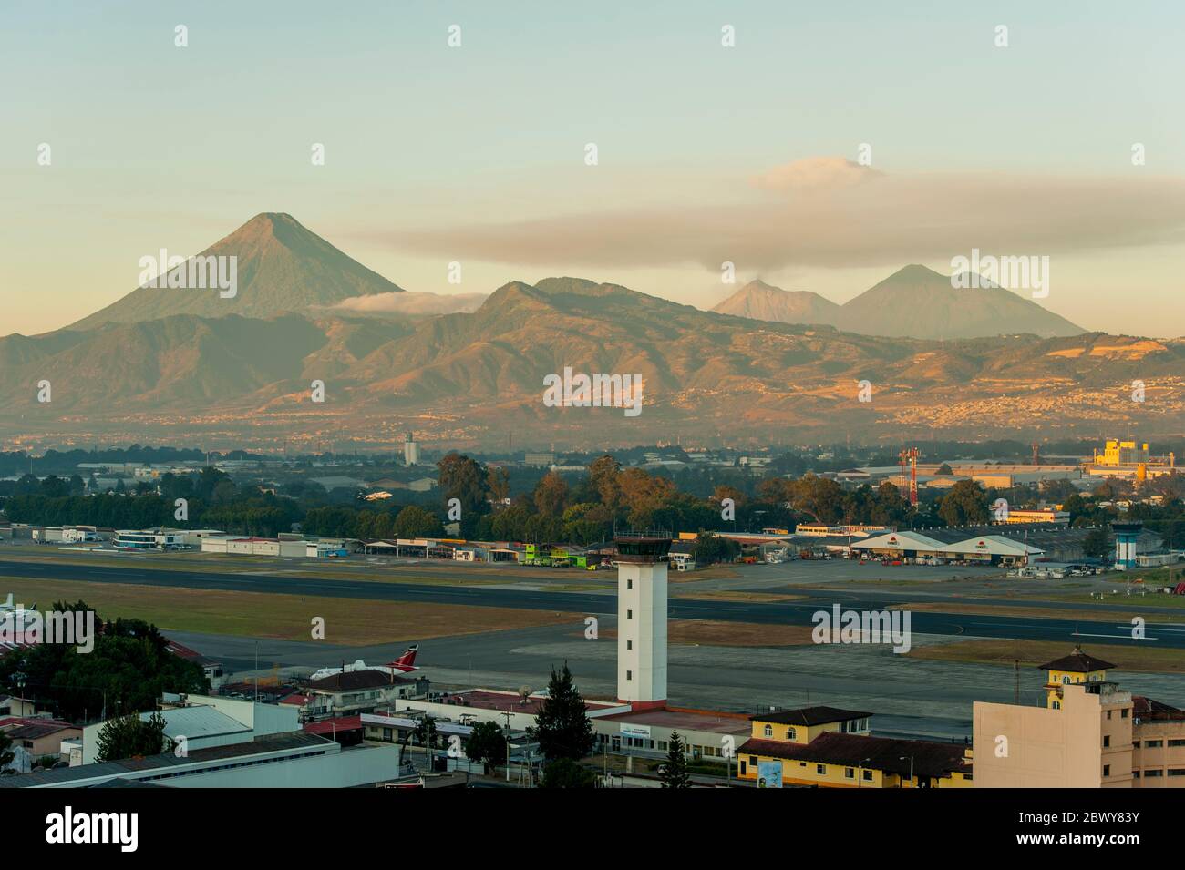 View of La Aurora International Airport in Guatemala City in Guatemala with the Agua volcano in the background. Stock Photo