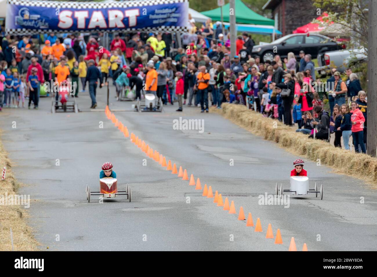 Saint John, New Brunswick, Canada - May 26, 2018: Unidentified children participate in the annual soap box derby while spectators watch . Stock Photo