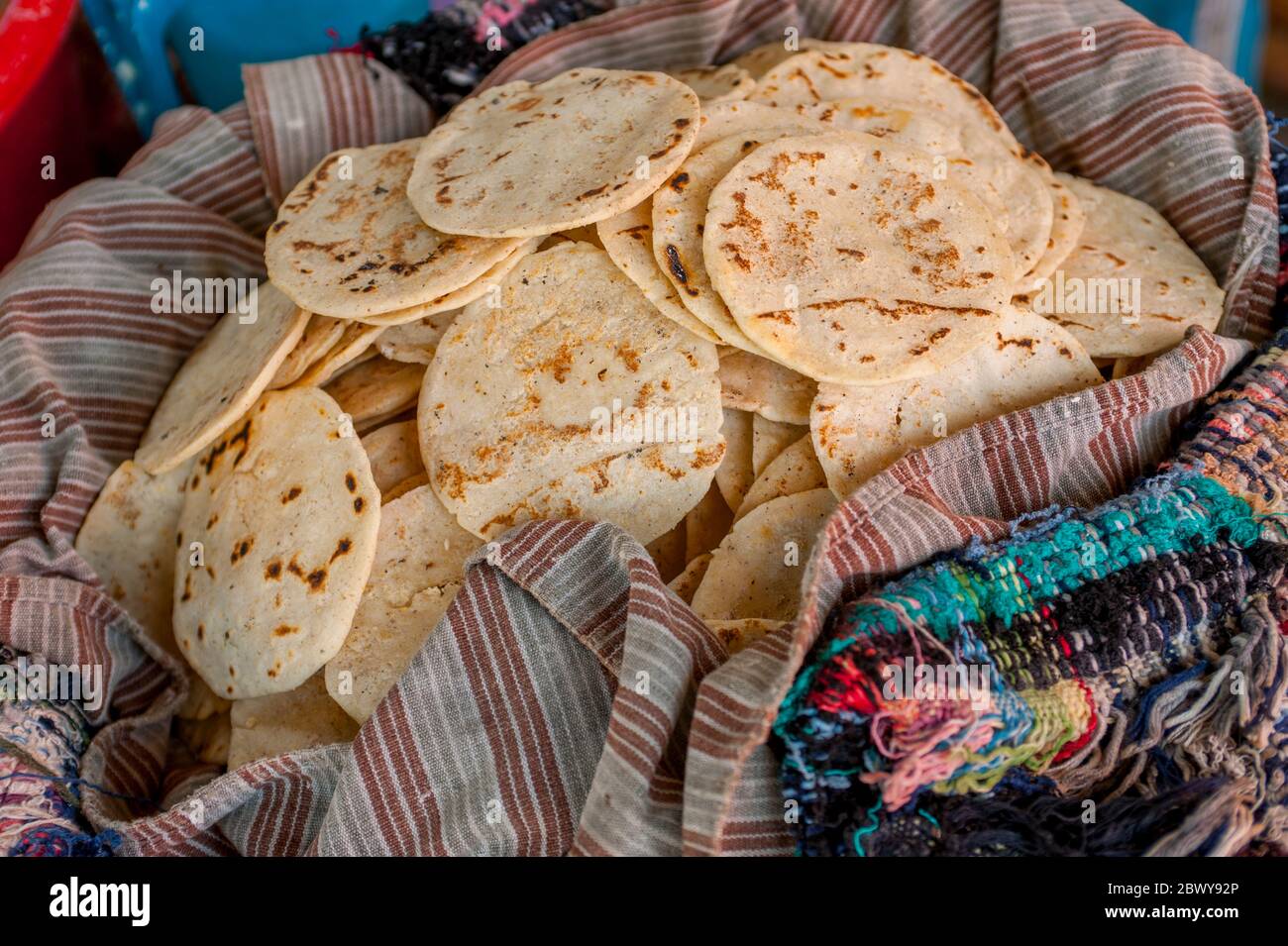 Tortillas for sale in a street market in the town of Santiago on Lake Atitlan in the southwestern highlands of Guatemala. Stock Photo