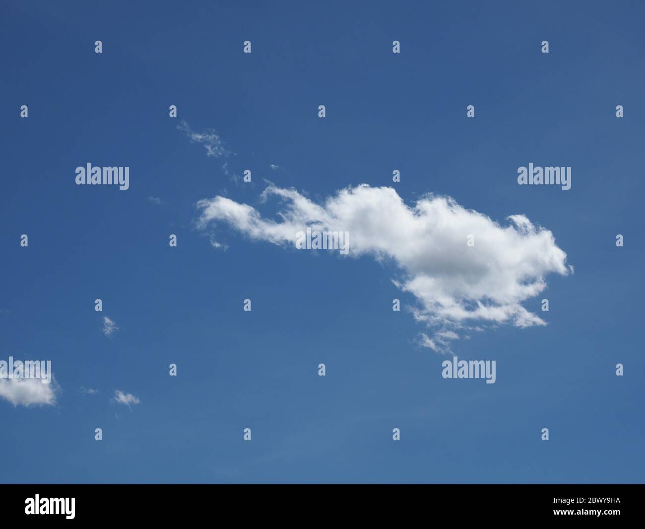 blue sky with cumulus clouds useful as a background Stock Photo - Alamy