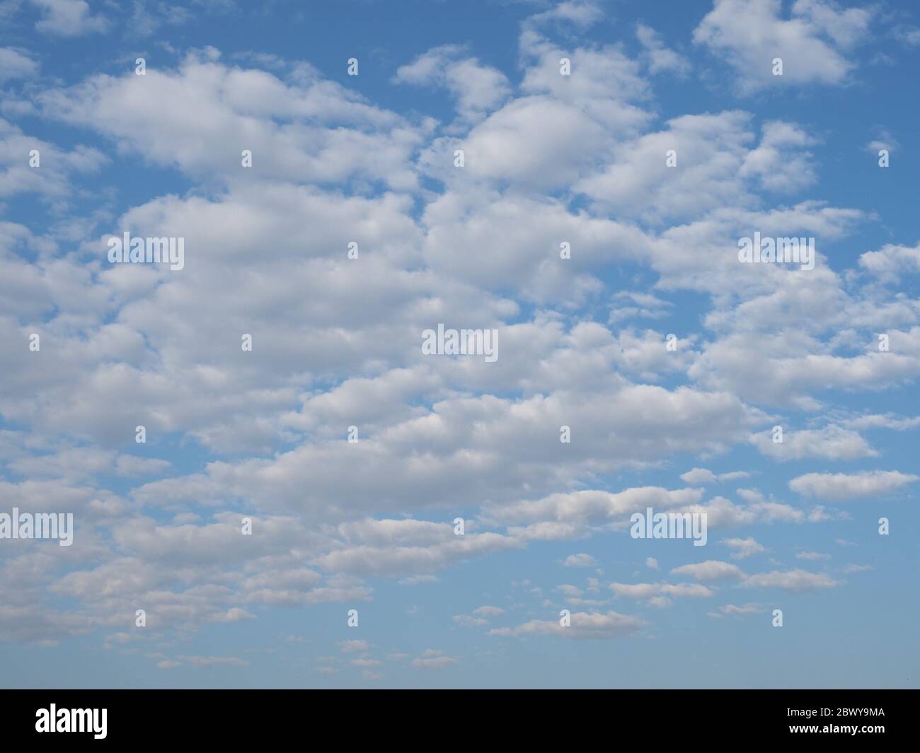 blue sky with clouds useful as a background Stock Photo - Alamy