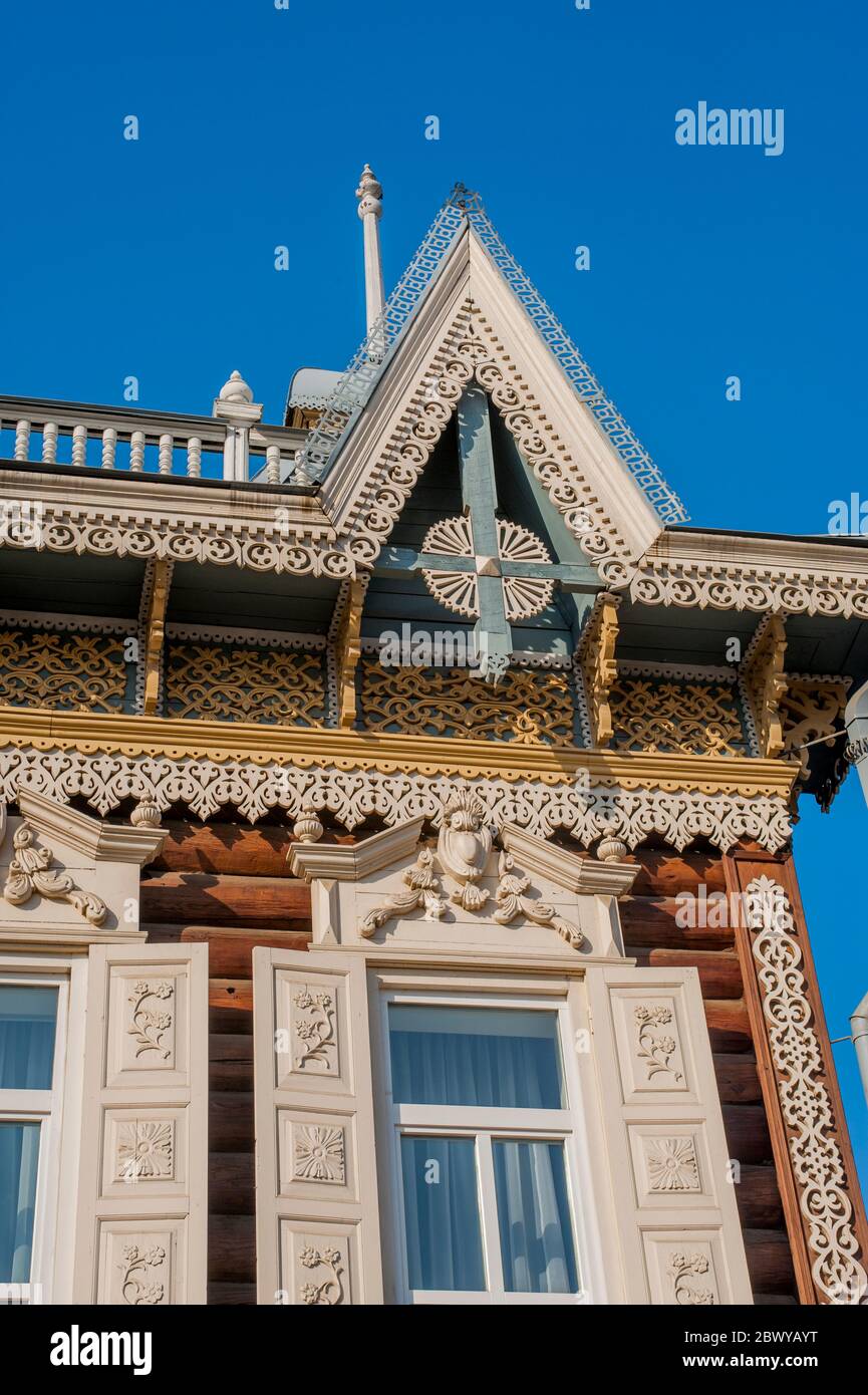 Detail of a traditional old wooden house, decorated with wooden, hand-made carvings, in Irkutsk, Siberia, Russia. Stock Photo