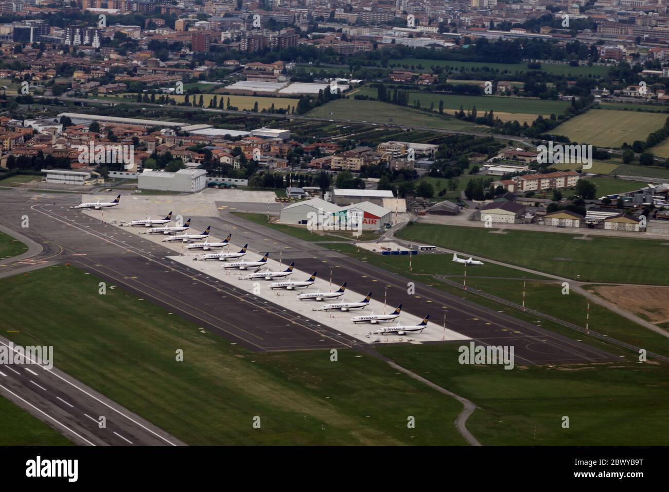 Aerial view of Bergamo airport, which is a Ryanair hub. Dozens of grounded  planes line up in Bergamo (LIME/BGY) International Airport due to lockdown  measures for coronavirus 2019. The airport itself closed