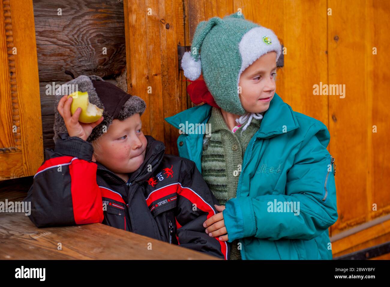 Two boys at the open-air museum Taltsy dedicated to the wooden architecture is located 20 kilometers away from the village of Listvyanka near Irkutsk, Stock Photo