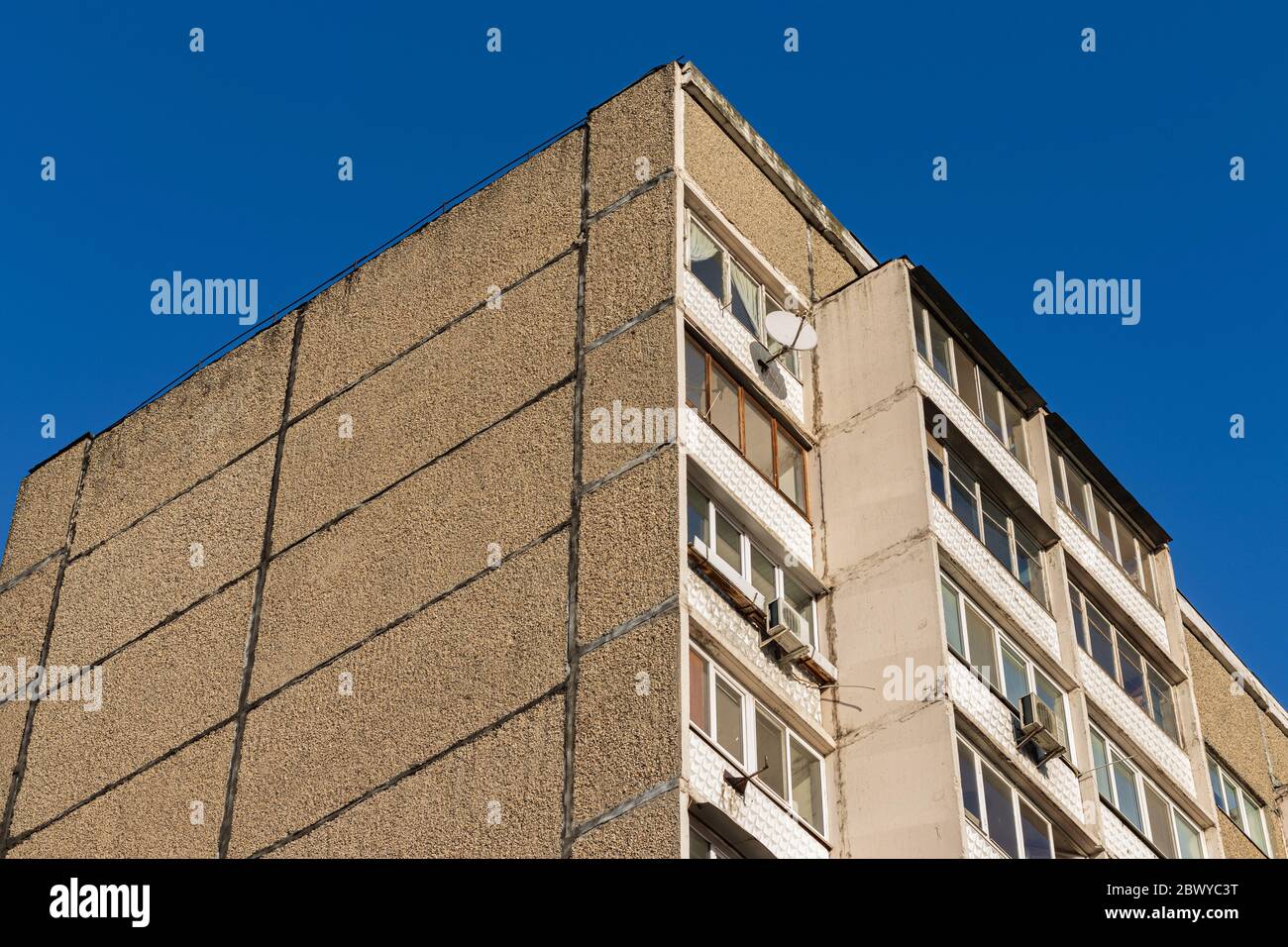 Soviet building corner on a blue sky background Stock Photo
