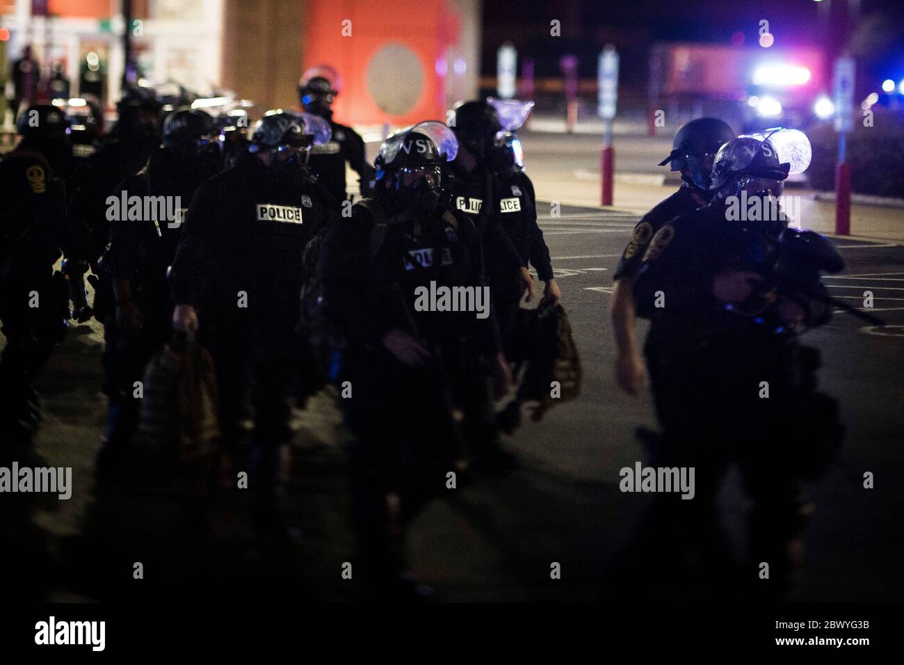 Hampton, Virginia, USA. 2nd June, 2020. Virginia State Police move in to join the combined police line near Target during the protest at the Peninsula Town Center on Tuesday June 2, 2020 in Richmond, VA. According to police, the protest was deemed an unlawful assembly after a smoke bomb was thrown and gunshots were heard from the crowd. Credit: John C. Clark/ZUMA Wire/Alamy Live News Stock Photo