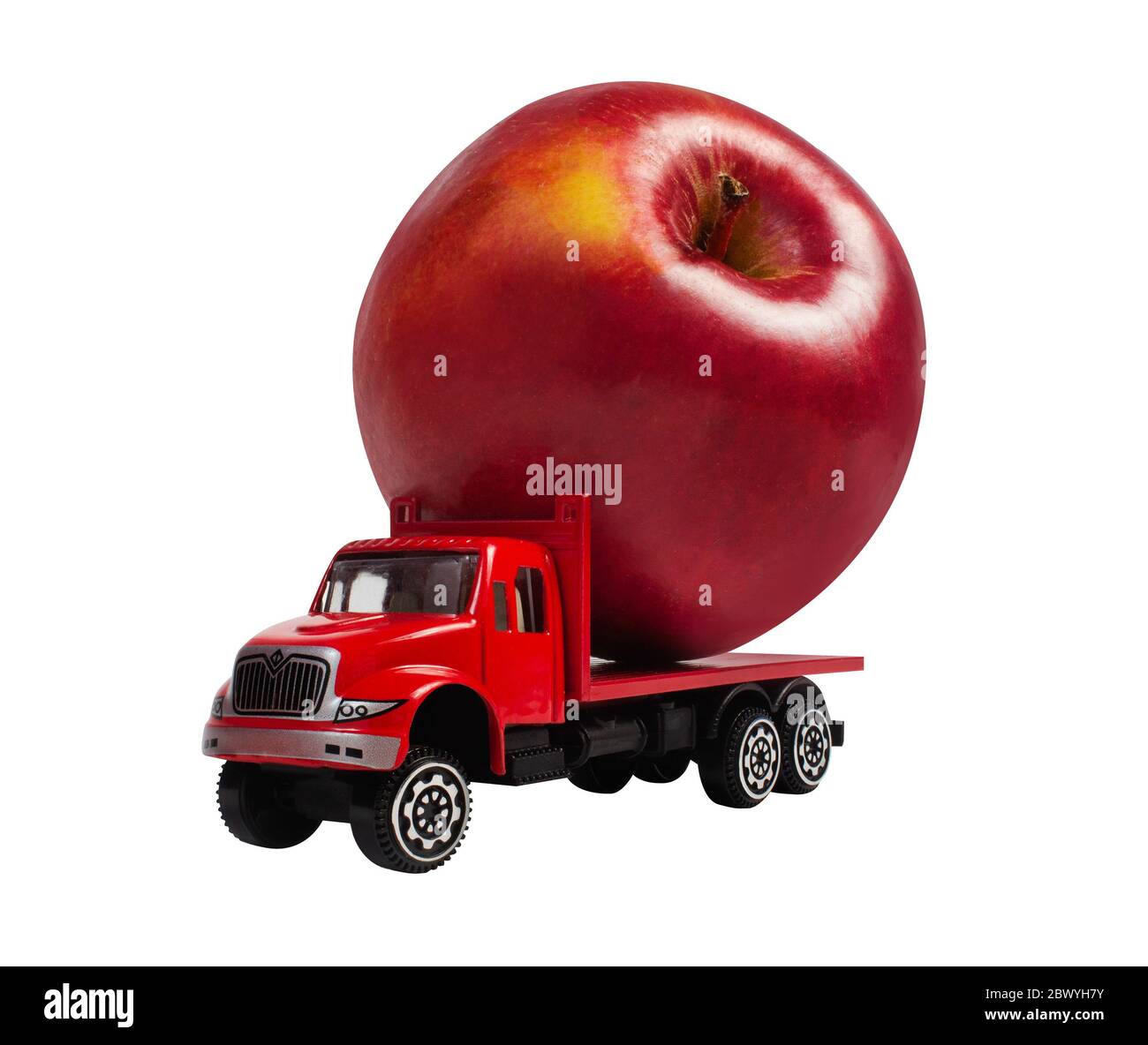 Isolated photo of a toy truck with apple cargo on white background angle view. Stock Photo