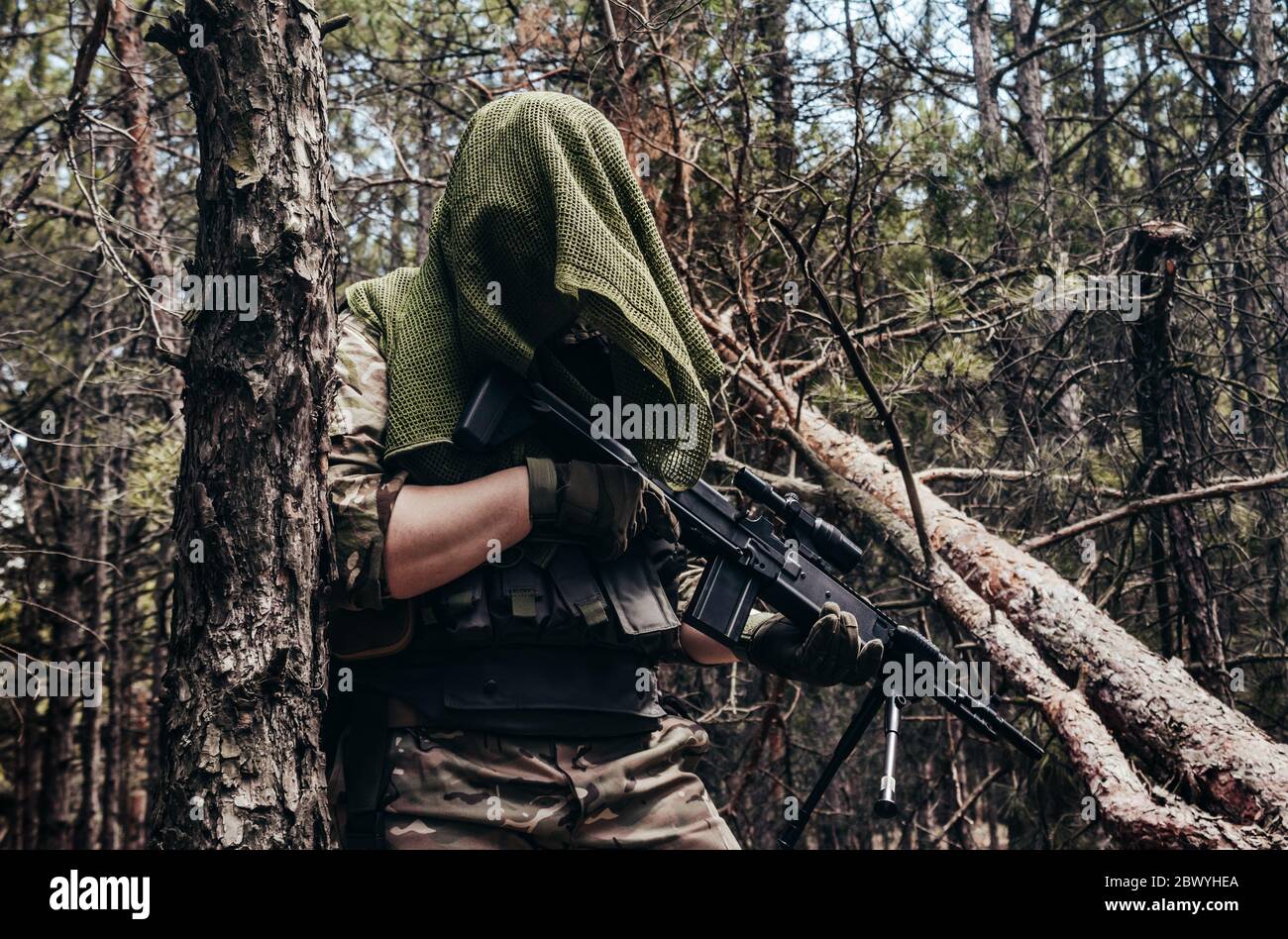 camouflaged sniper rifle with scope Stock Photo - Alamy