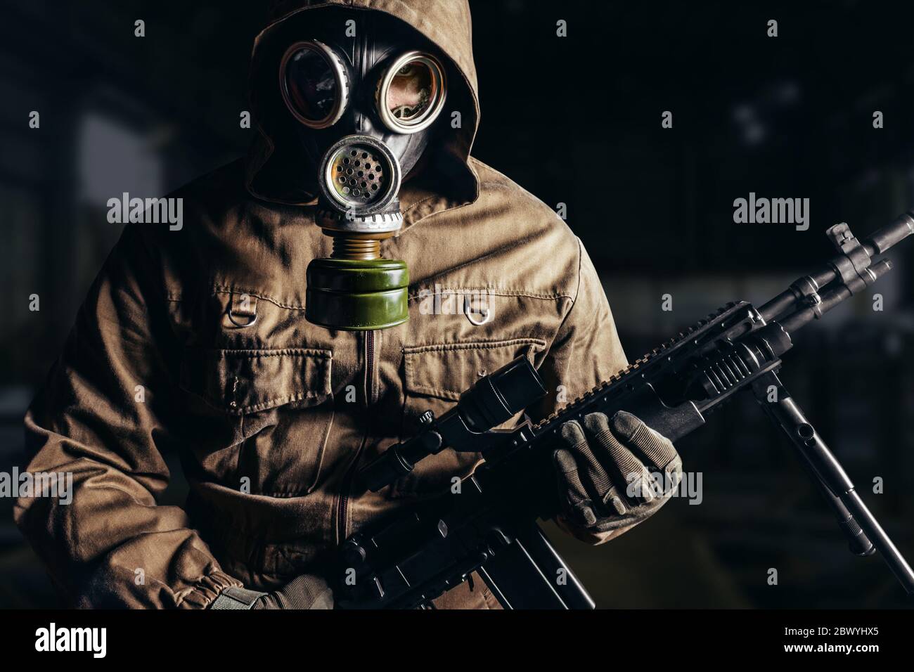 Photo of a stalker man in soviet gas mask holding sniper rifle Stock Photo  - Alamy