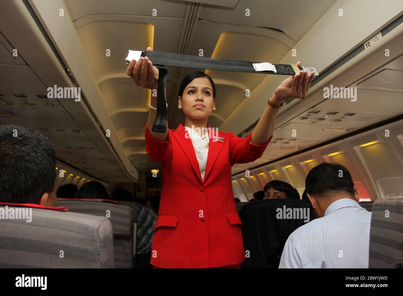 An Airhostess of Best Air doing safety demonstration just before flying from Zia International Airport now is Hazrat Shah Jalal International Airport Stock Photo