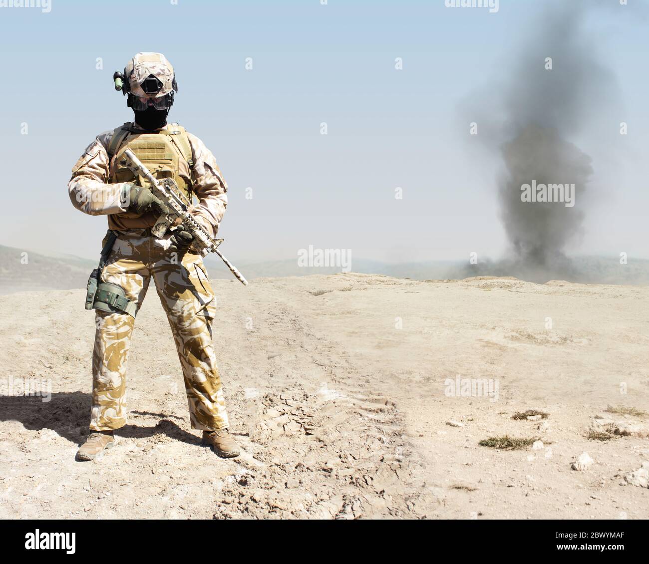 Photo of a fully equipped military soldier standing with automatic ...