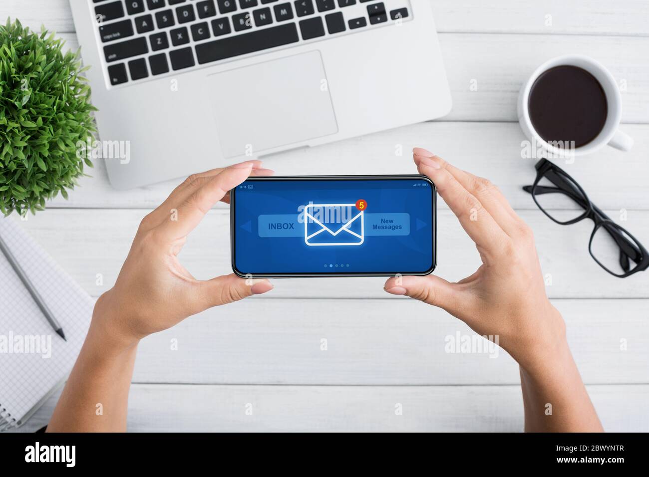 Unrecognizable Female Holding Smartphone With New Inbox Messages Notification On Screen Stock Photo