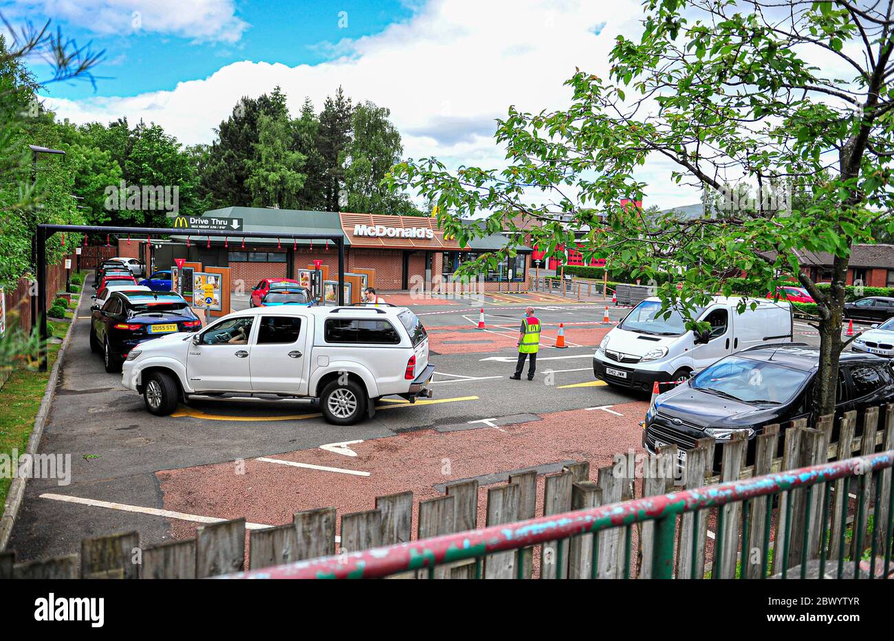 Alloa, UK. 03rd June, 2020. Customers are seen queuing at the drive-thru to order meals.McDonald's reopens its Alloa branch on Clackmannan Road as Drive-Thru only and implementing a one-way system to keep the flow of traffic going. Credit: SOPA Images Limited/Alamy Live News Stock Photo