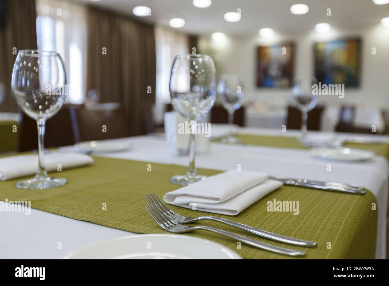 Focus on wine glasses on table in restaurant Stock Photo