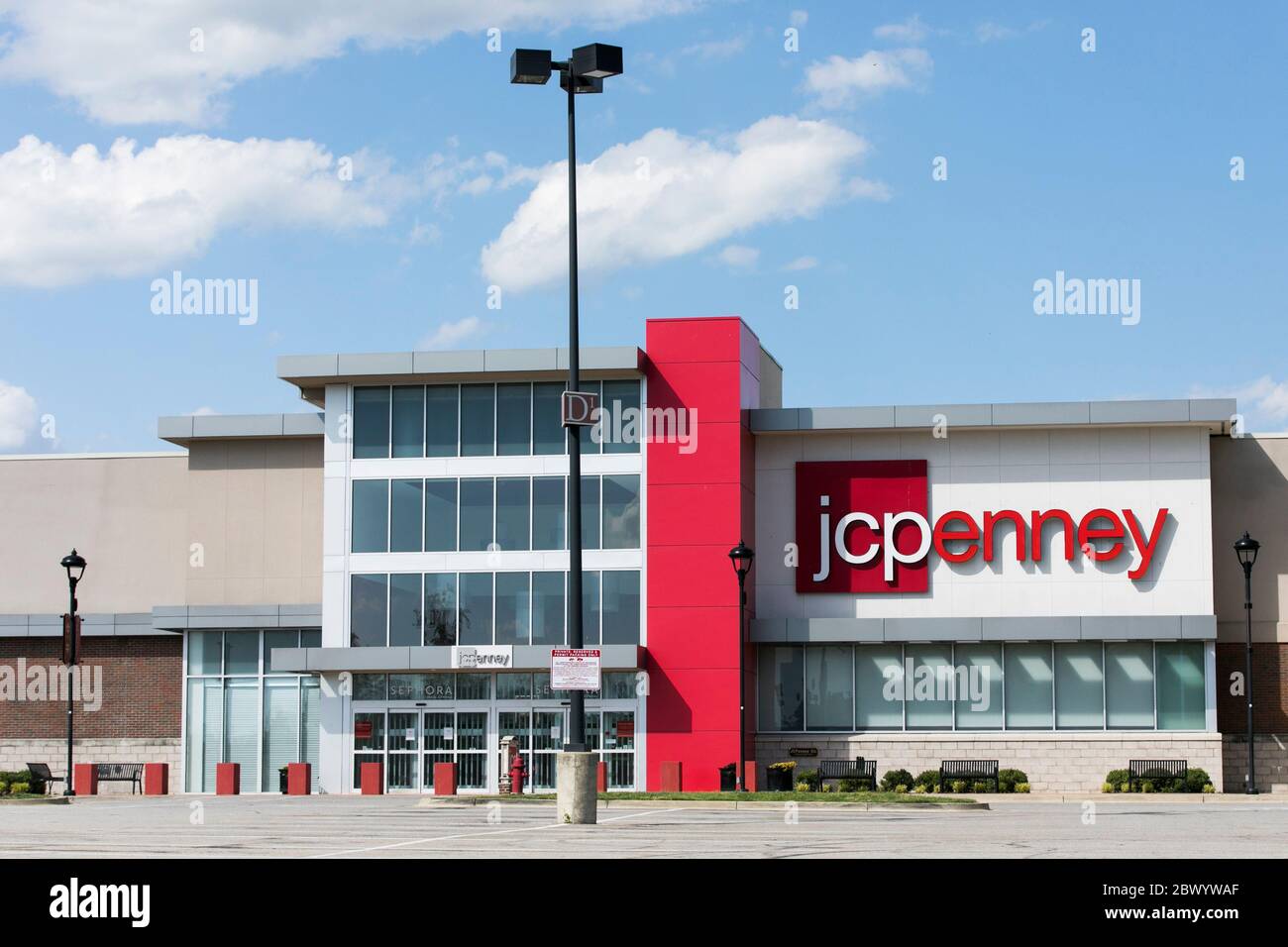 A logo sign outside of a JCPenney retail store location in Lanham