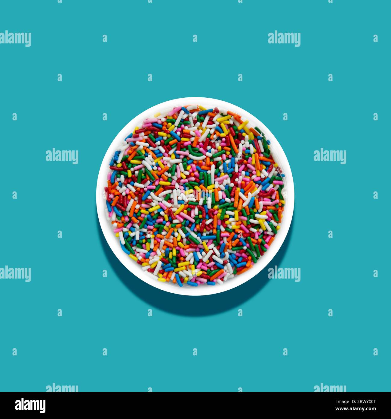 Rainbow sprinkles white background hires stock photography and images