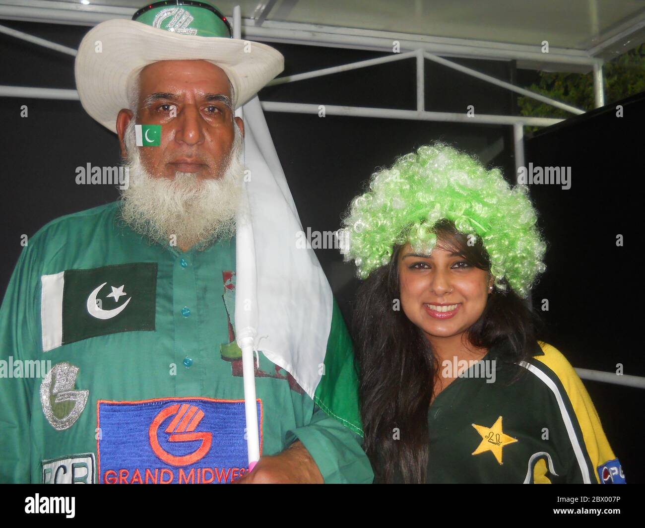 On left is Chaudhry Abdul Jalil, famously known as Chacha Cricket (Uncle Cricket), is a famous Pakistani cricket mascot. Together with another Pakistan supporter during the 2012 world T20 held in Sri Lanka. Stock Photo
