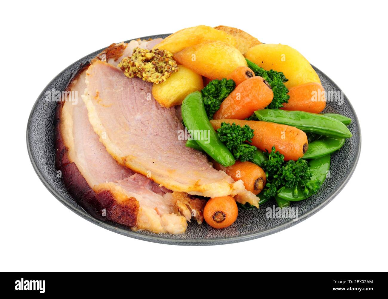 Roast gammon and vegetable meal isolated on a white background Stock