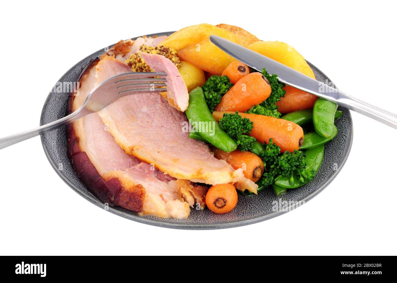 Roast gammon and vegetable meal isolated on a white background Stock