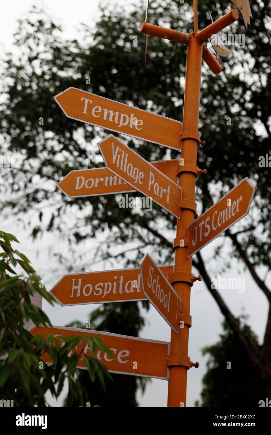 Directional sign boards at Sujata Academy complex in Dungeshwari, Bihar, India. The entire academy complex, where Sujata Technical School lies, also consists of other facilities such as hospital, dormitory, hall and Buddhist shrines. The school is a free school for children coming from poor families living on rural settlements in and around Dungeshwari—a village popularly known as a Buddhist pilgrimage destination site. Stock Photo
