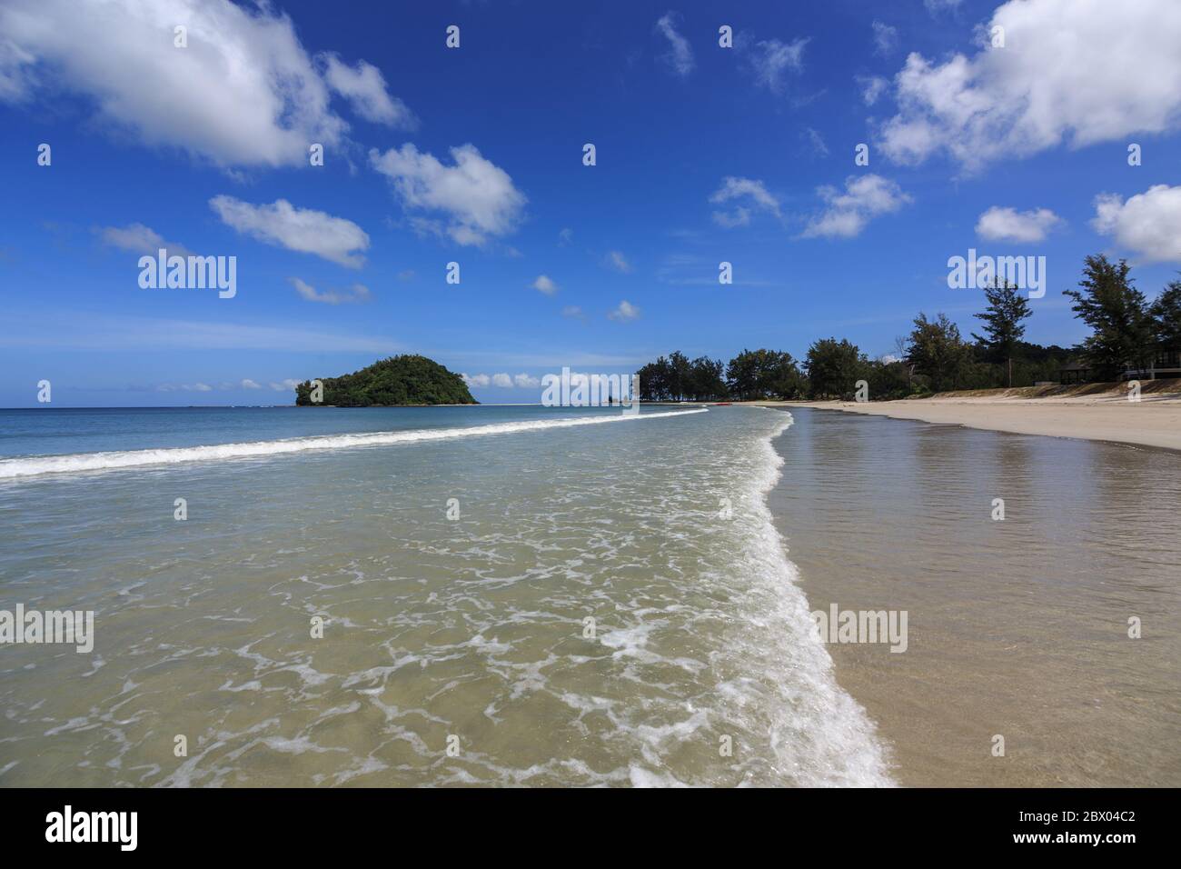 Beautiful Kelambu beach near tip of borneo malaysia with the clear blue sky - Travel Concept Stock Photo