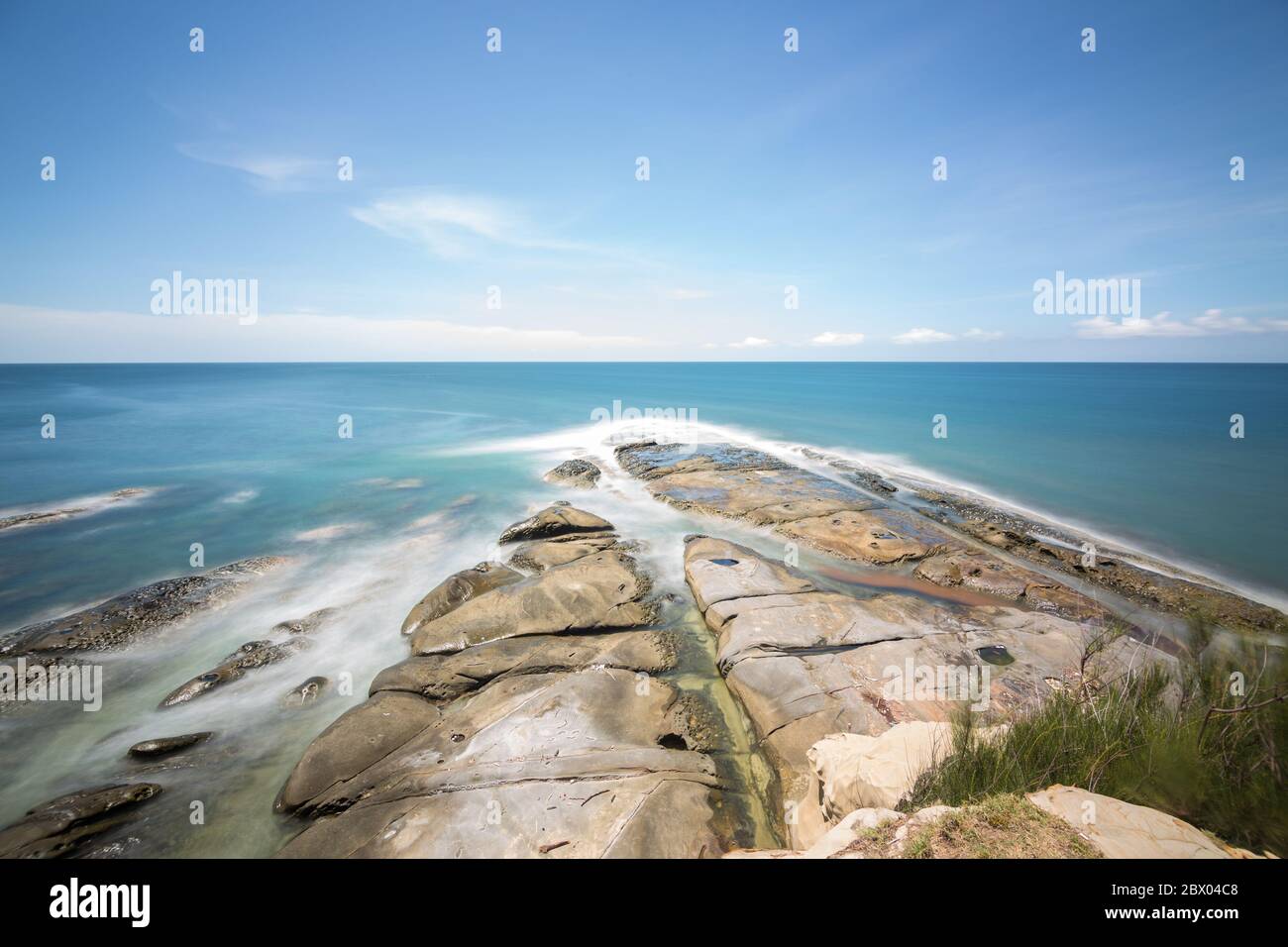 Long exposure of sea and clear blue sky in Tip Of Borneo, Kudat, Sabah Borneo, Malaysia.-Travel concept Stock Photo