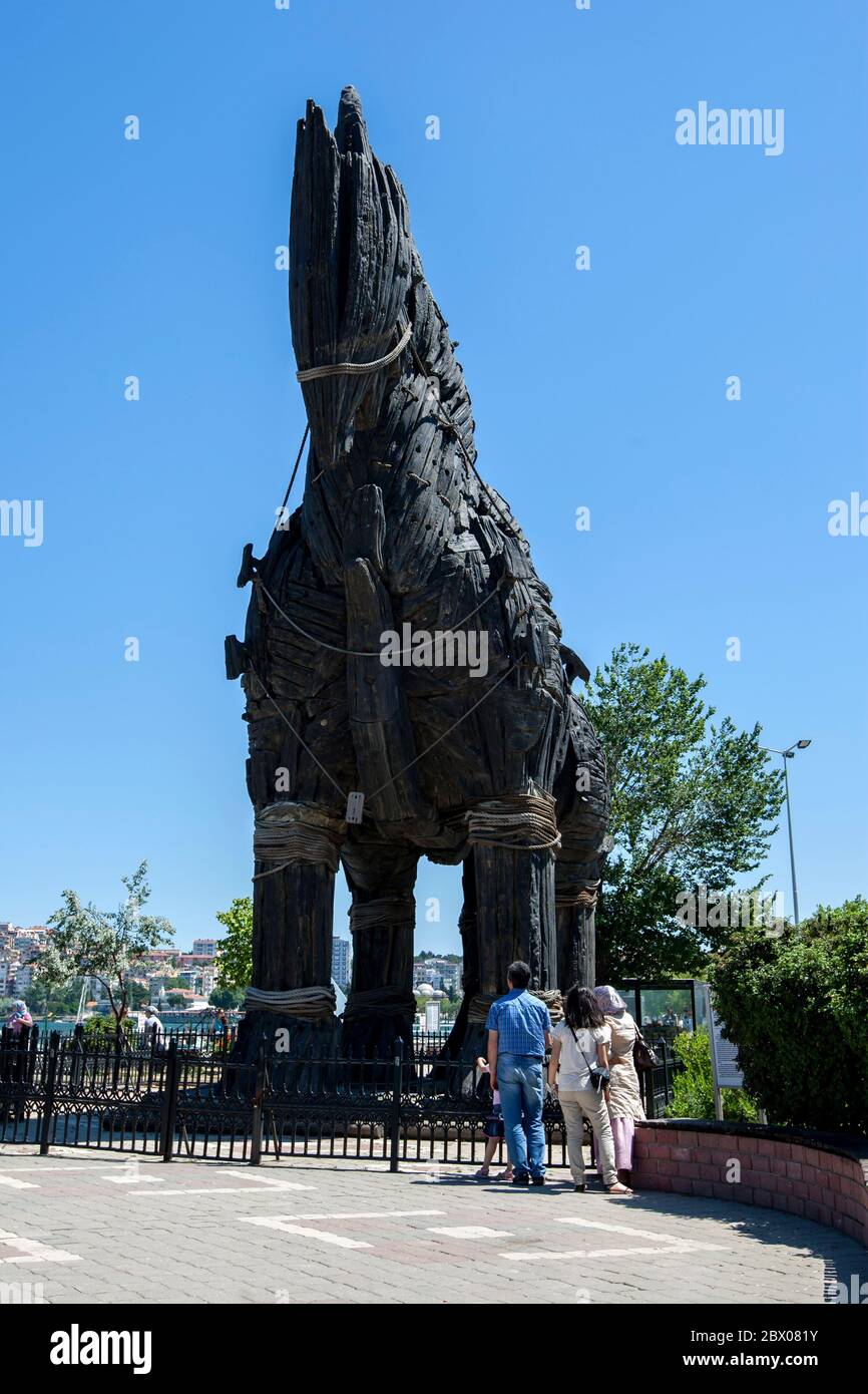People admire the Trojan Horse statue located at the harbour in Canakkale in Turkey. The horse is associated with the siege of Troy. Stock Photo