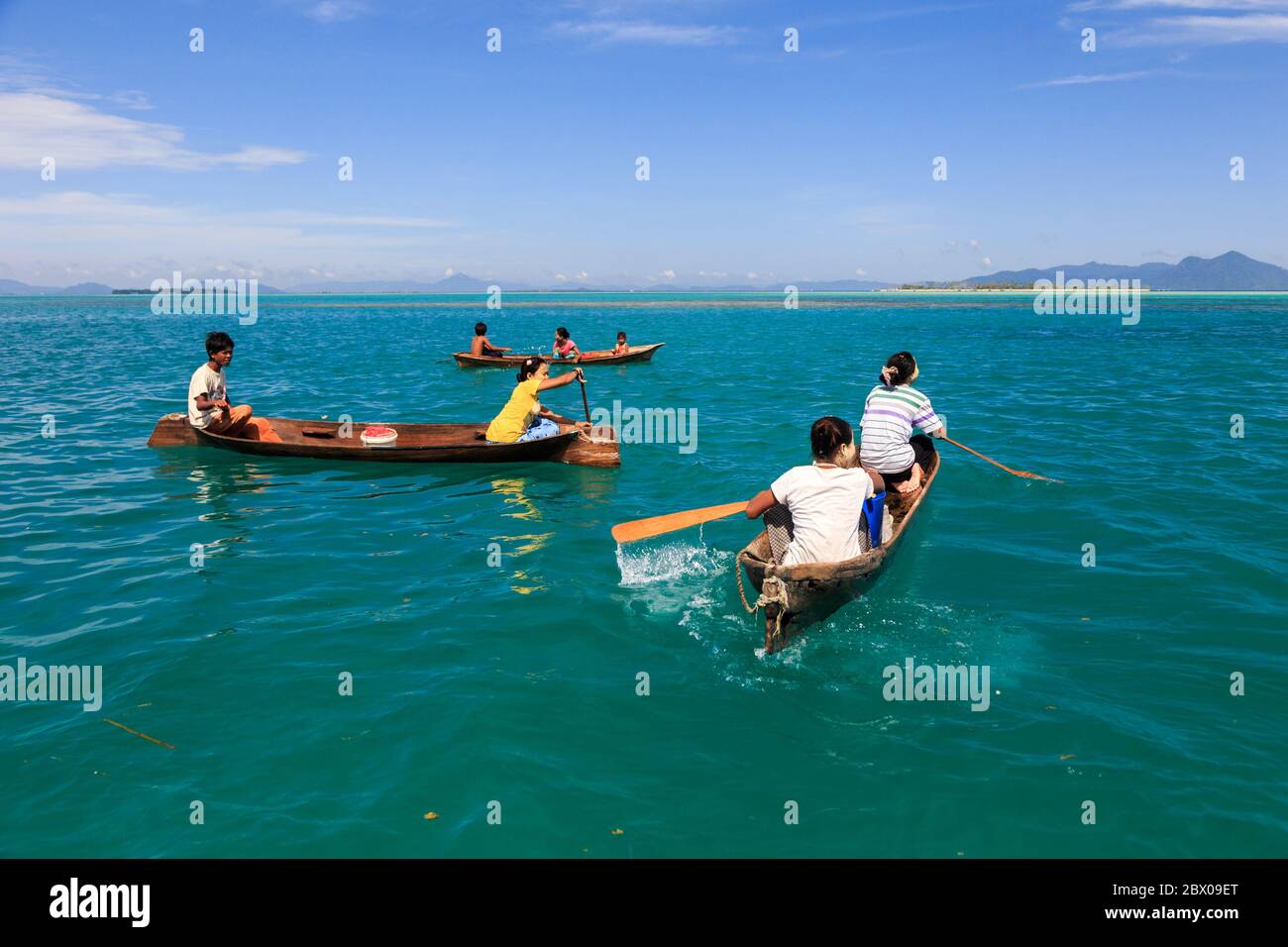 Semporna Sabah, Malaysia-CIRCA APRIL, 2017: Unidentified local BAJAU LAUT people on wooden boat in Bodgaya Island in Tun Sakaran marine park, Sabah Bo Stock Photo