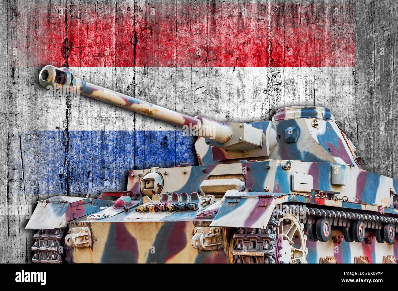 Military tank with concrete Netherland flag Stock Photo