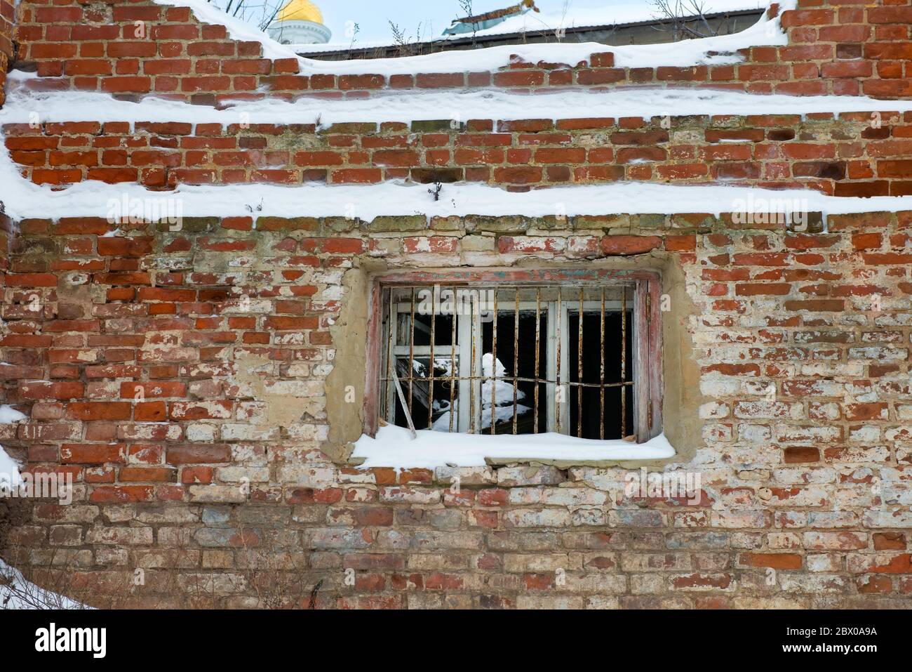 Empty window openings in an abandoned ruined red brick building Stock ...