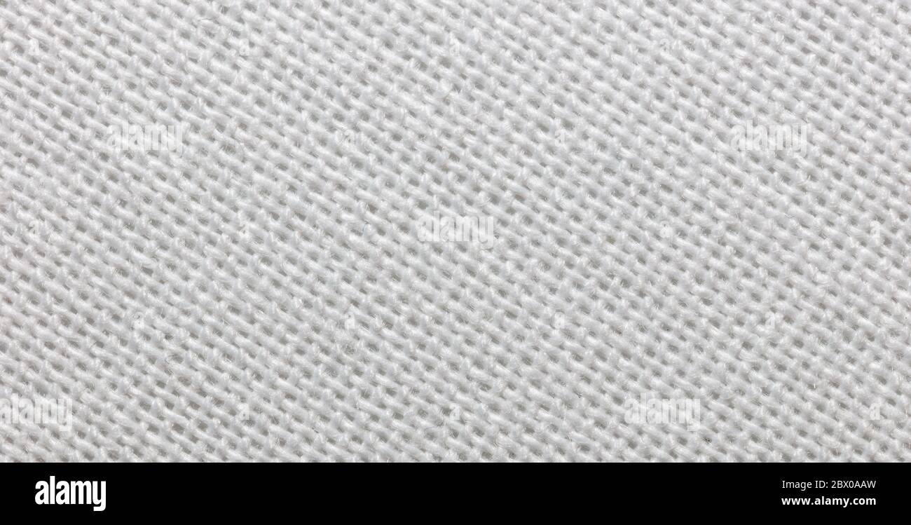 Close-up view of a piece of white fabric. Macro shot. Texture. Stock Photo