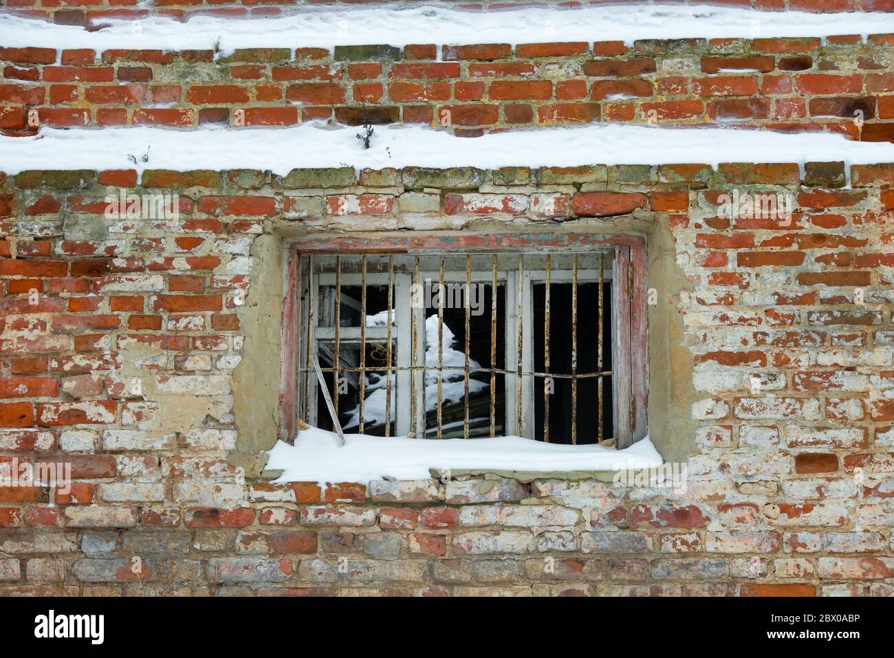 Empty window openings in an abandoned ruined red brick building Stock ...