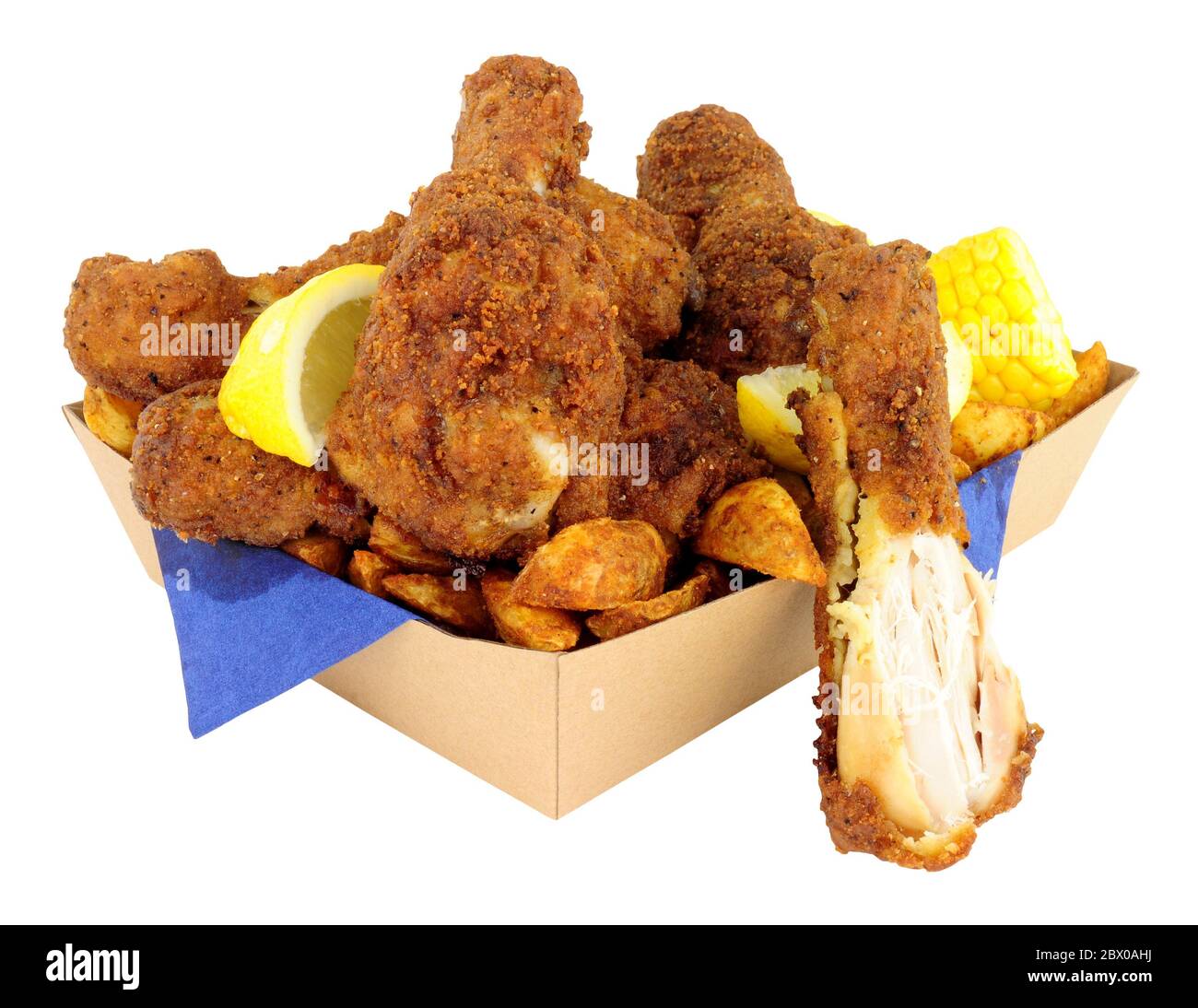 Southern fried chicken portions in a cardboard take away tray isolated on a white background
