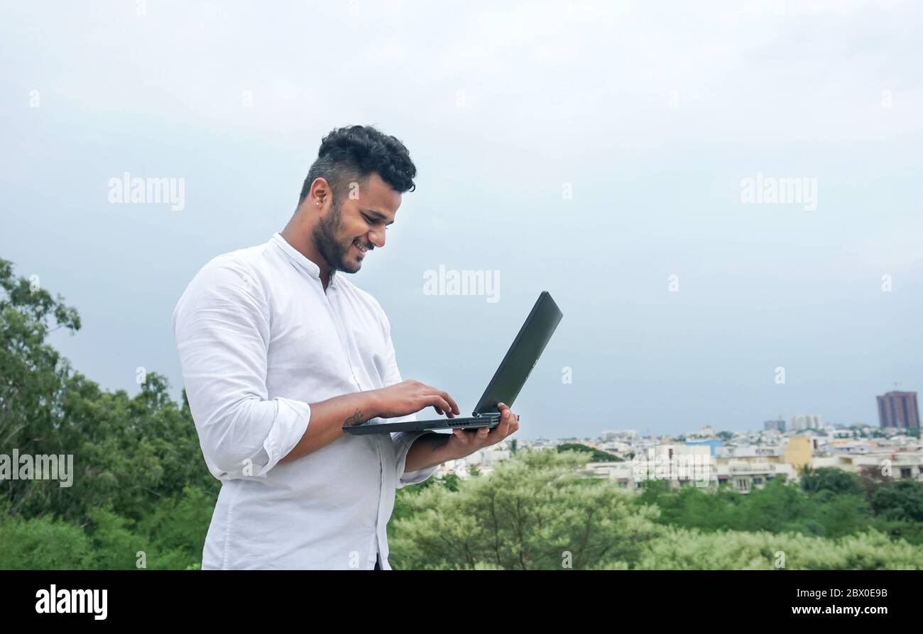 young man working on laptop Stock Photo