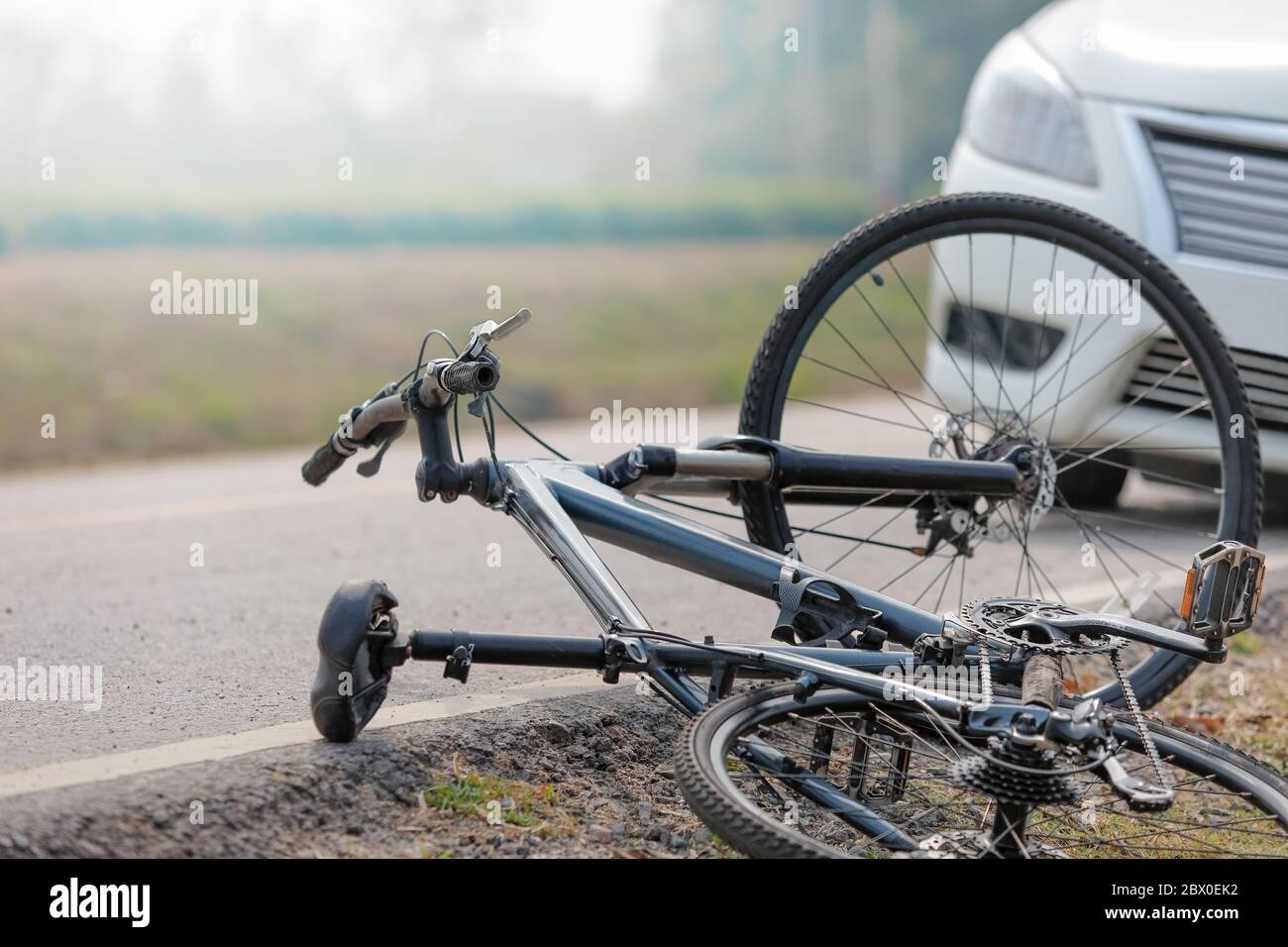 Accident car crash with bicycle on road Stock Photo