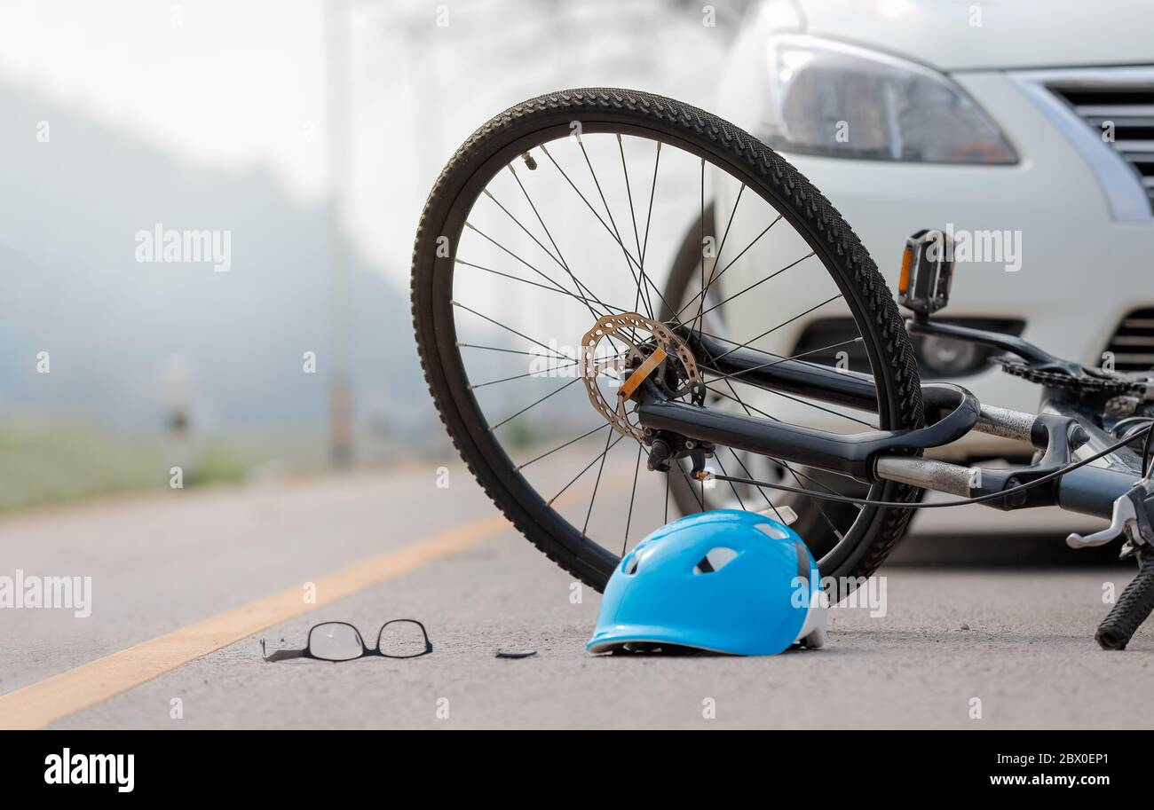 Accident car crash with bicycle on road Stock Photo