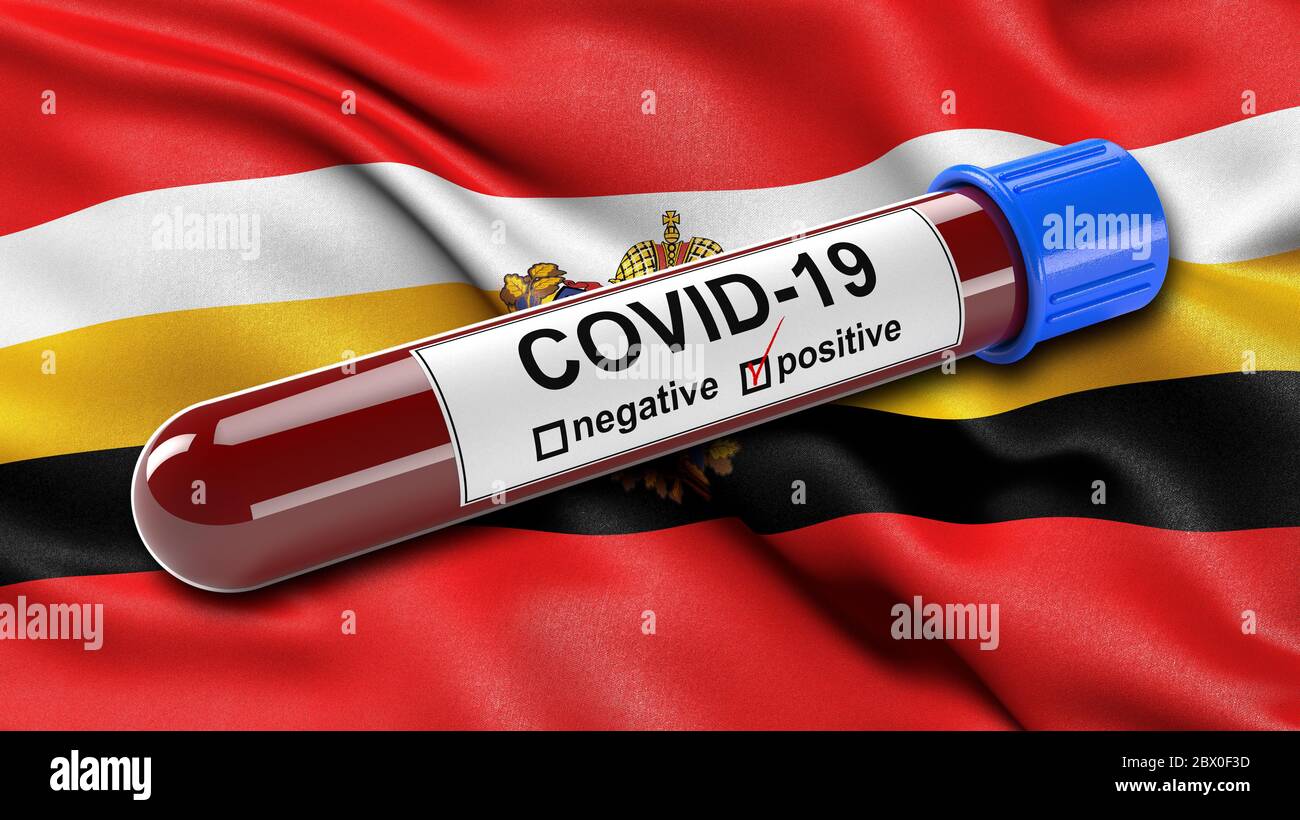 Flag of Kursk Oblast waving in the wind with a positive Covid-19 blood test tube. Stock Photo