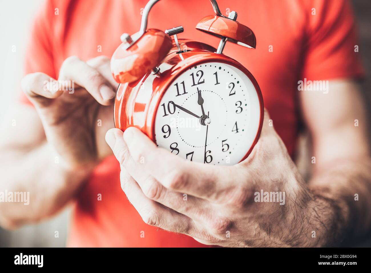 Setting the alarm at 7 am wake up early and do not oversleep Stock